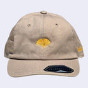 Light tan cap with a yellow-orange ginkgo leaf in the middle. "Giant Robot" is written in cursive along the side of the cap.