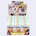 Display box for 18 blind box figures with cats attached to keychains within them.