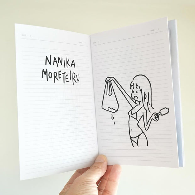 Open booklet with a drawing of a person holding a bag and a popsicle, with text on the opposite page.