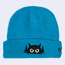 Teal blue knit beanie with a logo of a black embroidered robot head with angry eyes.