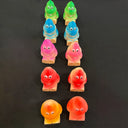 Colorful jelly baby figures on a black background