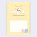 Inside view of a birthday card with birds around a multi layered cake with birthday wishes.