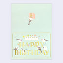 Birthday card with bold gold lettering that reads "Happy Birthday" with cartoon birds around it with party hats and balloons.