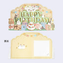 3D birthday card that reads "Happy Birthday" on a 3 tiered green stand with many cute birds wearing bowties sitting around. In the front are wrapped presents and a cake. Back view shows a place for writing a message.