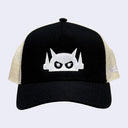Black cap with a white embroidered design of a robot head with an angry stare. Back of the hat is a cream colored mesh.