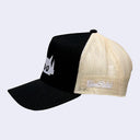 Black cap with a white embroidered design of a robot head with an angry stare. Back of the hat is a cream colored mesh.
