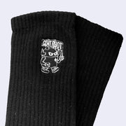 Black socks featuring a small embroidery on the upper calf part of a robot carrying a flag that reads "Giant Robot."