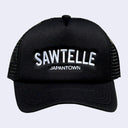 BLACK snapback cap with mesh backing. Text reads "SAWTELLE" in large white sans serif font with "Japantown" written below in smaller, matching font.