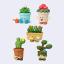 Set of colorful potted plant figurines with faces on a light gray background