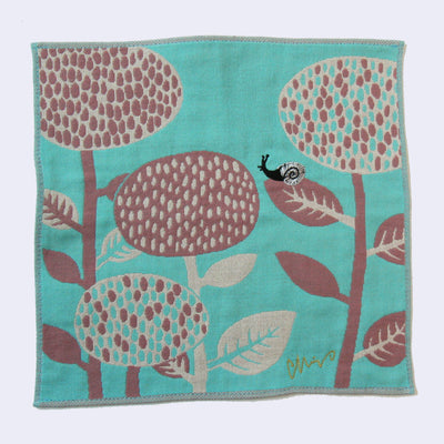 Blue square shaped handkerchief, with a design of a small black and gray snail on rounded flowers - a reddish purple with cream colored accent.