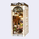 Miniature model of a cafe interior with detailed decor on a white background