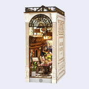 Miniature model of a cafe interior with detailed decor on a white background