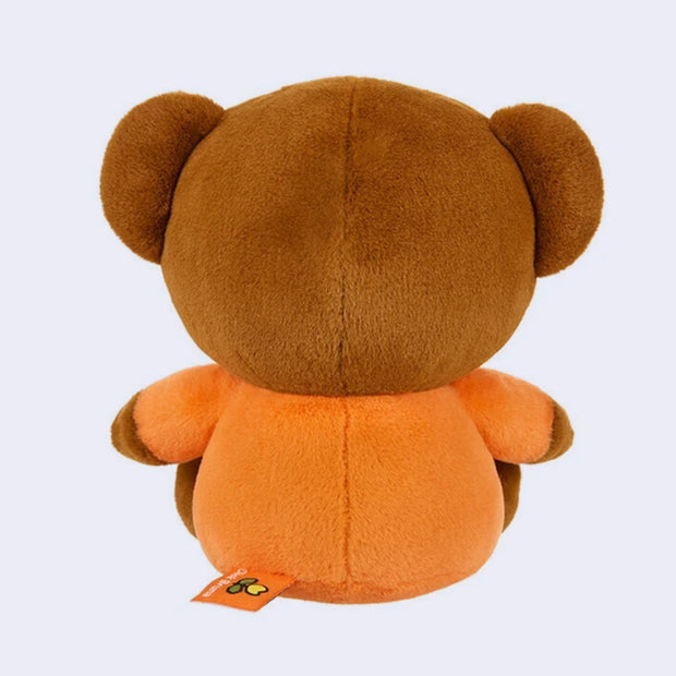 Brown and orange plush toy on a light gray background