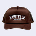 Brown snapback cap with mesh backing. Text reads "SAWTELLE" in large white sans serif font with "Japantown" written below in smaller, matching font.