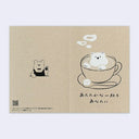 Kraft brown greeting card with japanese text and an illustration of a cup of coffee with a saucer, spoon, sugar cube and bear made out of foam within the latte.