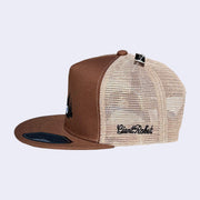 Brown and beige trucker cap with mesh back and "giant robot" embroidered on the side.