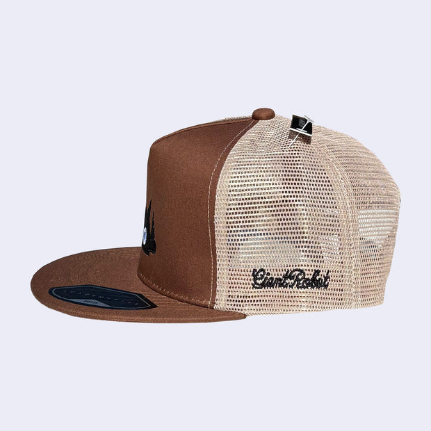 Brown and beige trucker cap with mesh back and "giant robot" embroidered on the side.