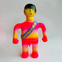 Colorful toy figure with a sash on a white background