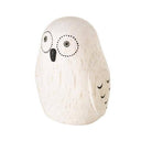 Wooden owl figurine with black details on a white background