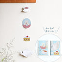 Paper mobile of tea themed illustrations.