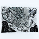 Drawing of a dragon, done in an old Japanese or East Asian art style with black clouds.