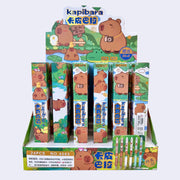 Display of Kapibara-themed pens in blind box packaging with cartoon characters on a white background