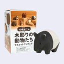 A small black-and-white wooden animal mascot toy shown next to its retail box on a plain light gray background. The box features Japanese text and illustrations of wooden animal figures.