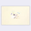 A rectangular cream-colored envelope featuring a watercolor illustration of two cats sitting together, one white with dark patches and one tan and cream, both wearing party hats with a small blue fish above them.