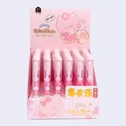 Display case of 48 pink pens with clear bodies that show sakura flowers inside and small cat heads.