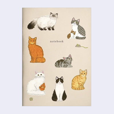 Notebook with a light brown color cover and illustrations of cats, in various sitting and standing positions.