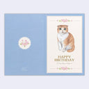 Birthday card with a cat illustration on a light blue background