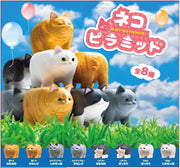 Promo sheet displaying many small plastic cats, with boxy bodies stacked atop of one another.