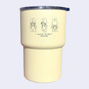 Light yellow tumbler with a line art illustration of a small girl wearing bunny ears and angel wings. She stands in 3 different angles with text below that reads "I need to fart"