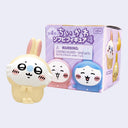 Cute figurine with packaging on a light purple background