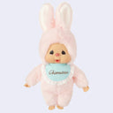 Plush toy in a pink bunny costume a blue laced bib that reads 'Chimutan' on a light purple background