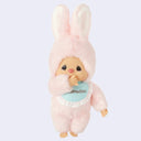 Plush toy in a pink bunny costume a blue laced bib that reads 'Chimutan' on a light purple background