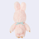 Plush toy in a pink bunny costume a blue laced bib that reads 'Chimutan' on a light purple background
