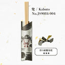 Japanese Kabuto chopstick holder packaging with a samurai helmet illustration, shown with two wooden chopsticks inserted and a small folded paper crane graphic on a white background with printed text.