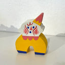 Colorful wooden clown figure on a white background