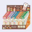 Display of Clutto eraser packages with colorful packaging and branding.