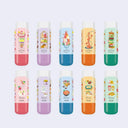 Set of colorful erasers with cartoon designs on a light blue background