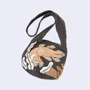 Dark gray sling, shoulder bag with an orange and white graphic of a coelacanth fish swimming over rocks and near coral.