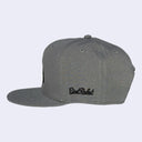 Gray cap with black logo on a light gray background