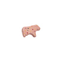 Small ceramic figurine of a pink frosted animal cookie with sprinkles, shaped like a cow.