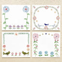4 memo pad sheets all with different floral themed borders.