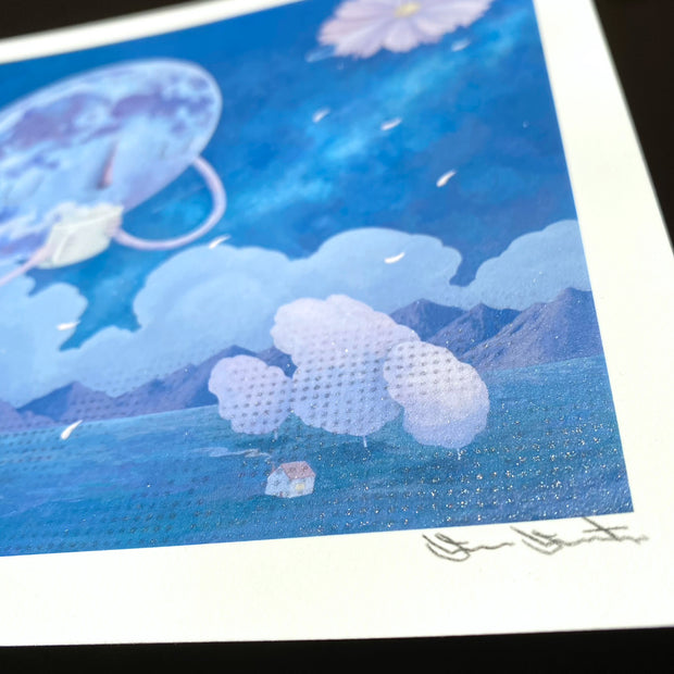 Side angle of "Cozy Up" showing a metallic silver detailing along the bottom of the image area, a pattern of dots. Painted pink petals fall from the flower moon.