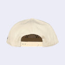 Beige cap on a light gray background
