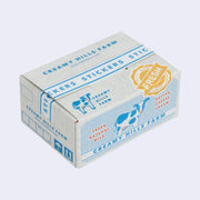 Box of stickers, made to look like a cardboard shipping box holding dairy products, with labeling and illustrations on the exterior that mimic the real thing.