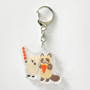 Keychain with cartoon raccoons on a white background