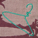 Close up of embroidered detailing of a hanger on a towel.